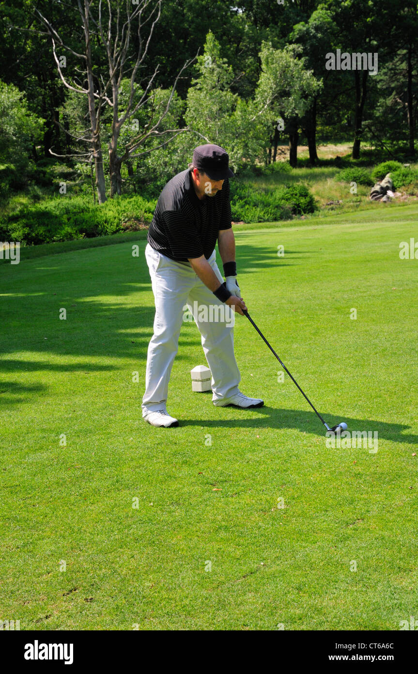 A golfer prepares to tee off at the Pocono Manor golf course