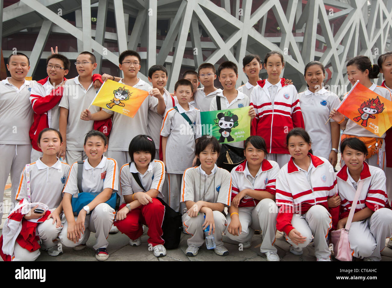 Chinese schoolchildren pose in front of the Olympic Stadium in Beijing, China in September, 2008. Stock Photo