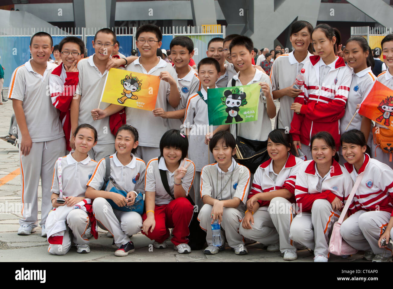 Chinese schoolchildren pose in front of the Olympic Stadium in Beijing, China in September, 2008. Stock Photo