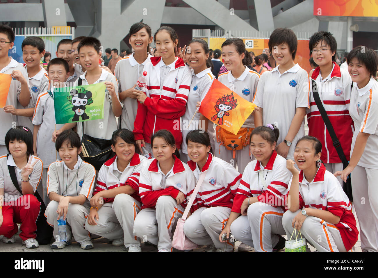 Chinese schoolchildren pose in front of the Olympic Stadium in Beijing, China in September, 2008. Stock Photo