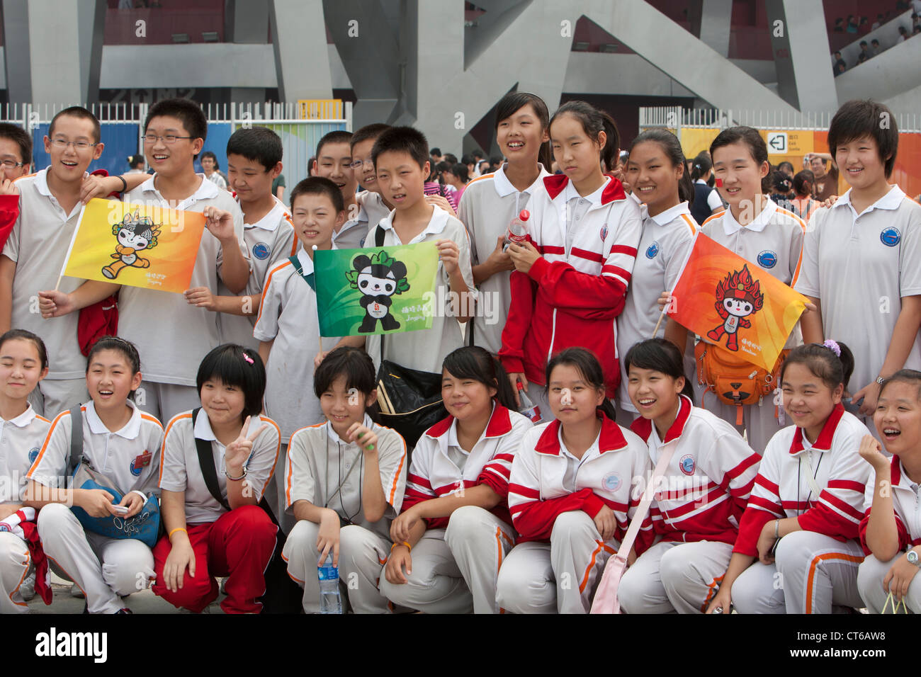 Chinese schoolchildren pose in front of the Olympic Stadium in Beijing, China in September, 2008. Stock Photo