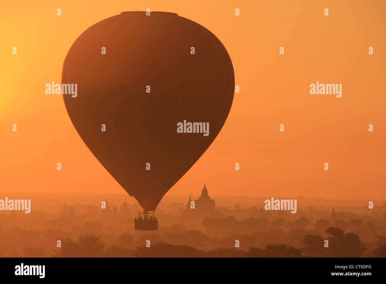Hot-air ballooning at sunrise, Bagan Archaeological Zone, Mandalay region, Myanmar, Southeast Asia Stock Photo