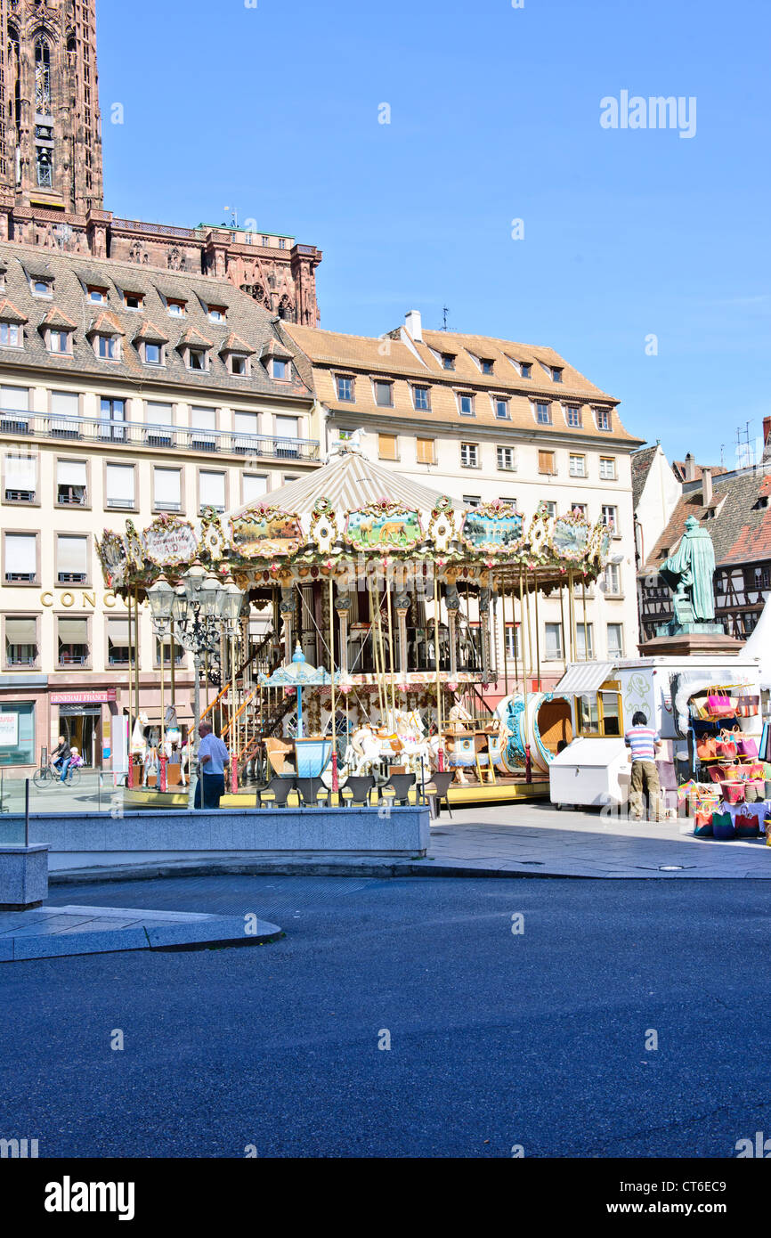 A carousel (from French carrousel, from Italian carosello),or merry-go-round,Place Gutenberg,Strasbourg,France Stock Photo