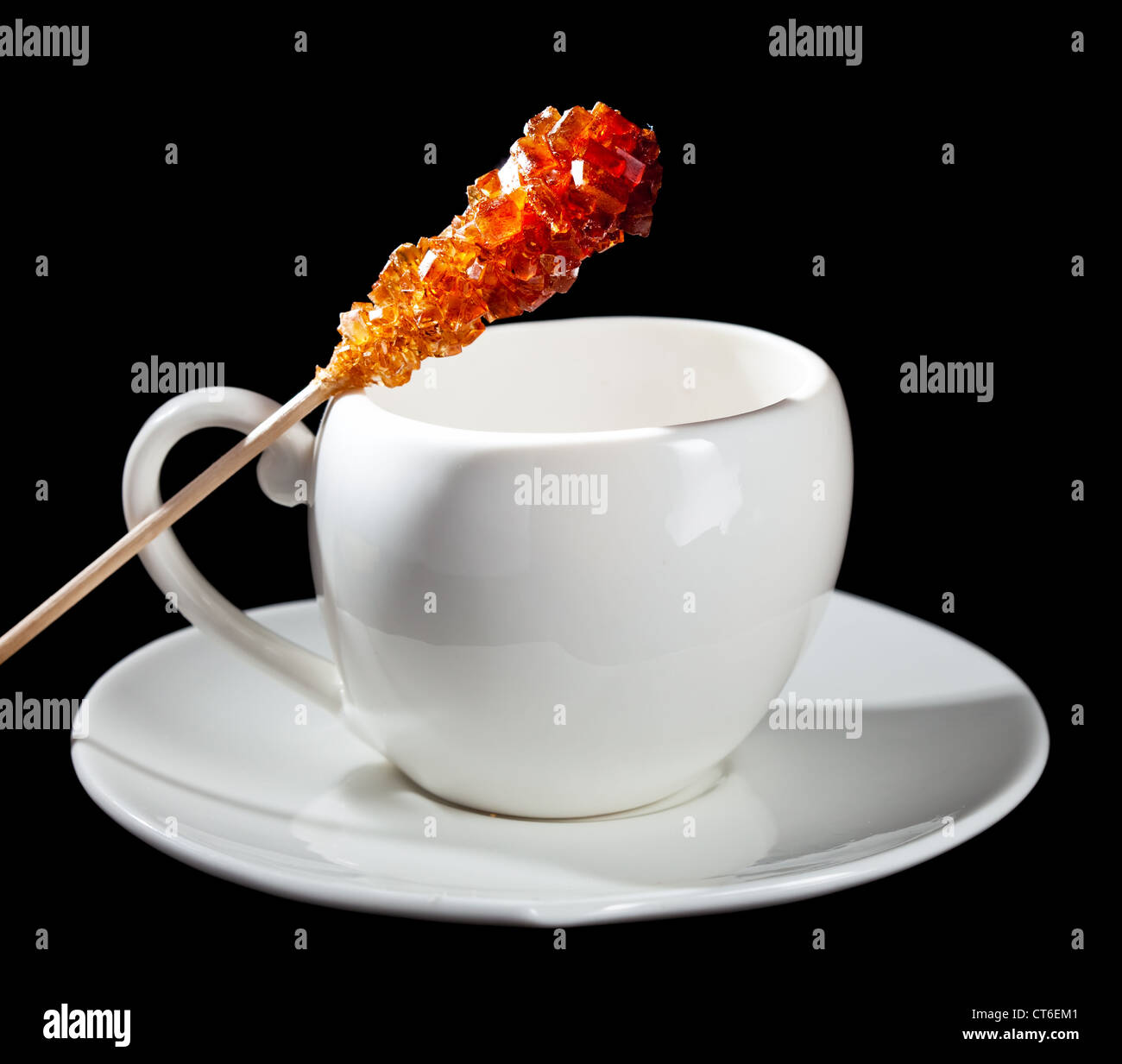 Coffee cup and candy sugar on a stick Stock Photo