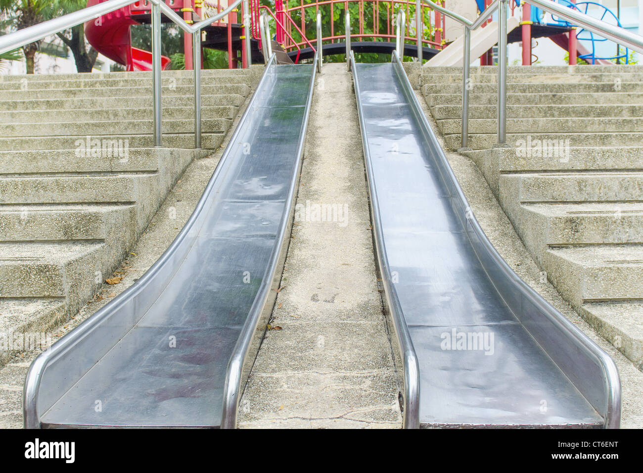 Double metal slides on a playground Stock Photo Alamy