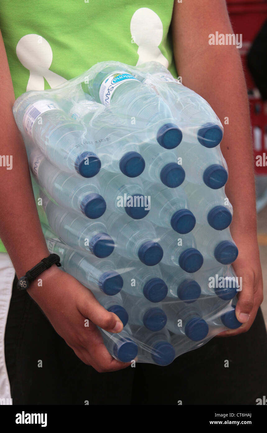 Volunteer carrying water at World Youth Day Stock Photo