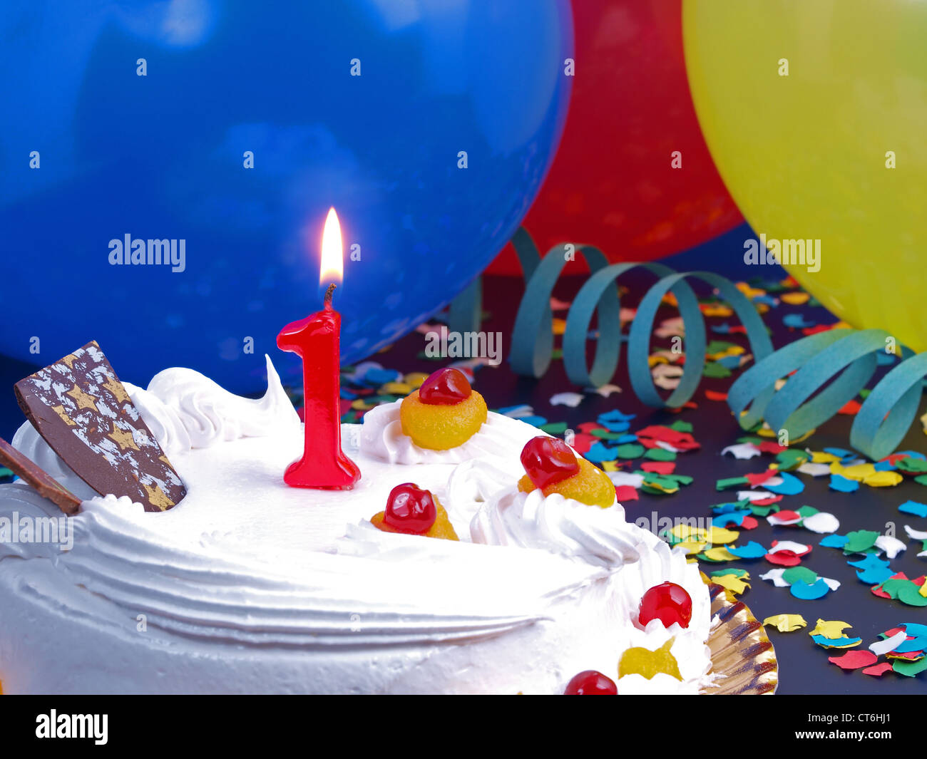 Birthday-anniversary cake with red candle showing Nr. 1 Stock Photo