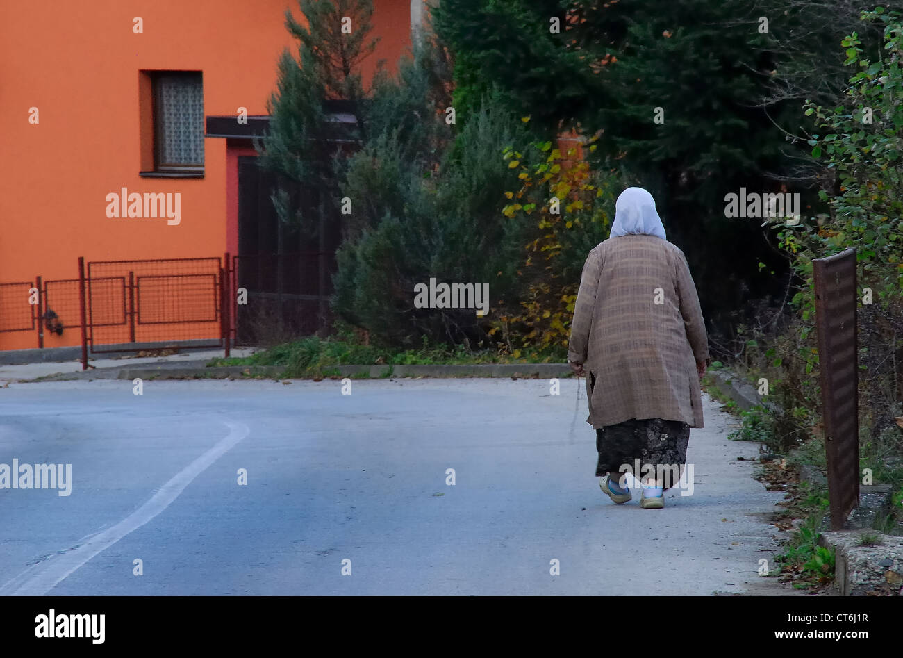 Bosnia, Srebrenica :  an old woman in a street of Sebrenica. Stock Photo