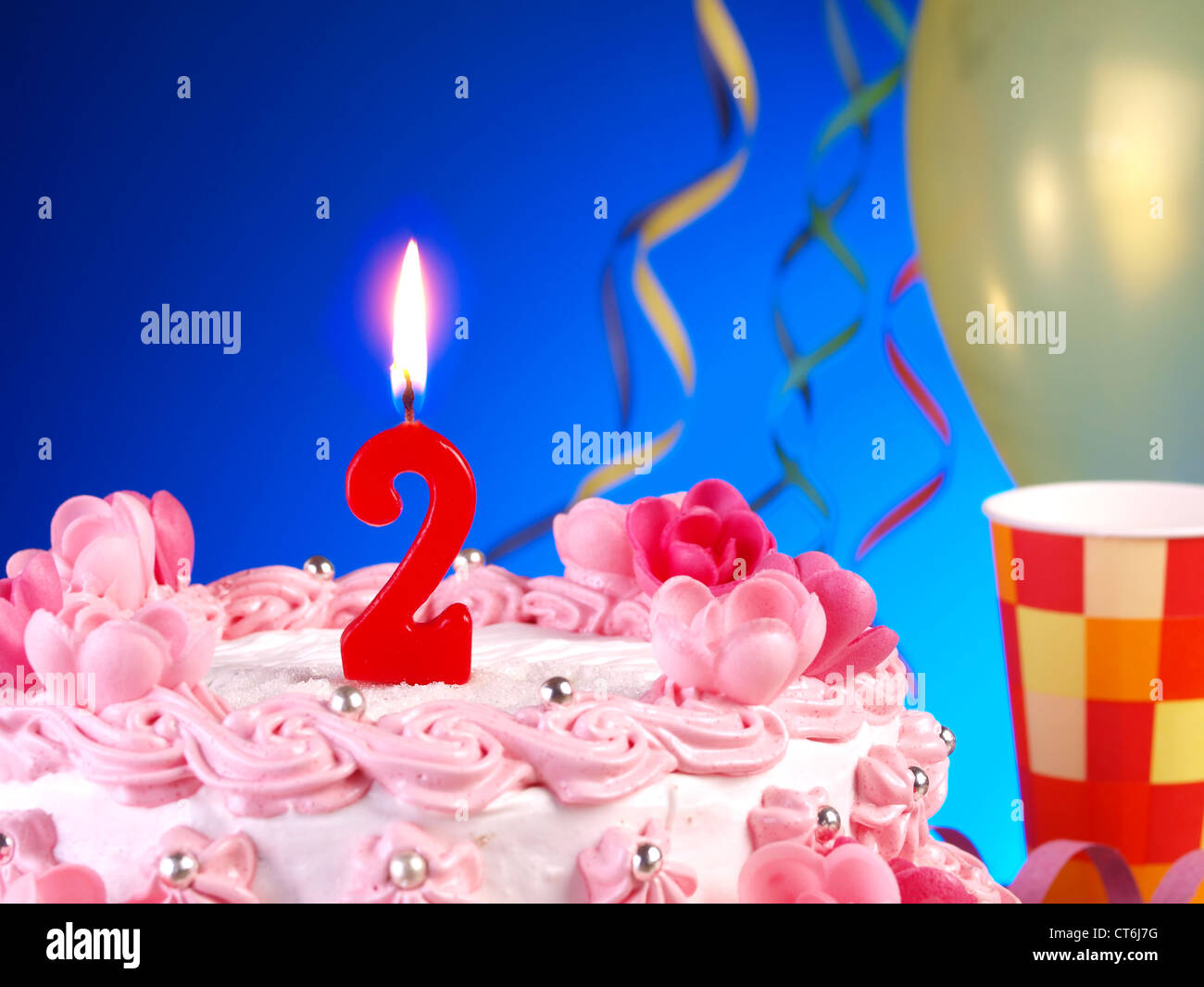Birthdayanniversary cake with red candles showing Nr. 2 Stock Photo Alamy