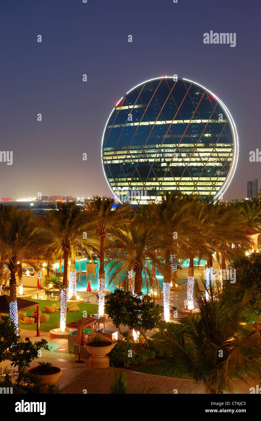 Night illumination in the luxury hotel and circular building, Abu Dhabi, UAE Stock Photo