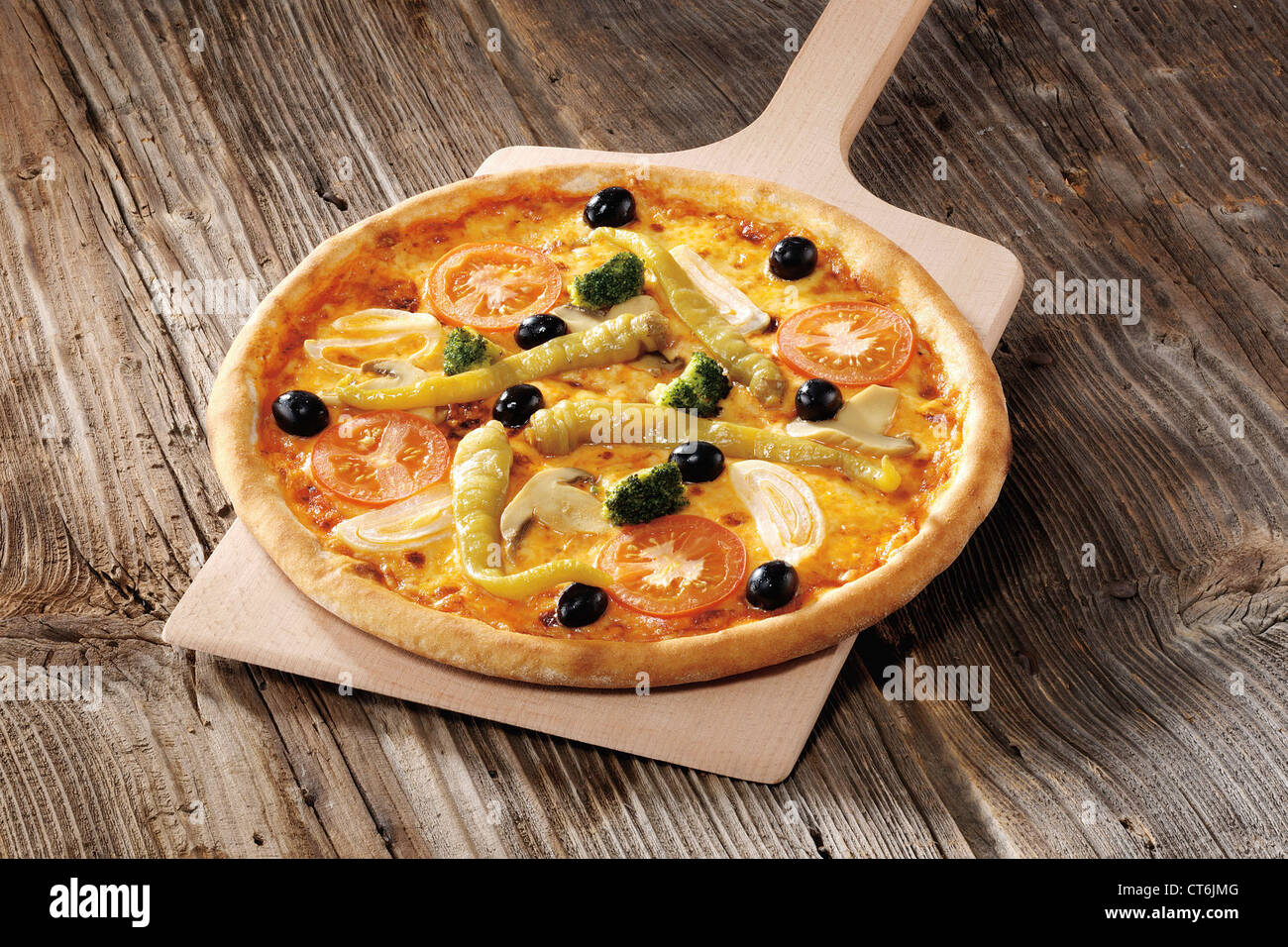 Pizza on slide Stock Photo - Alamy