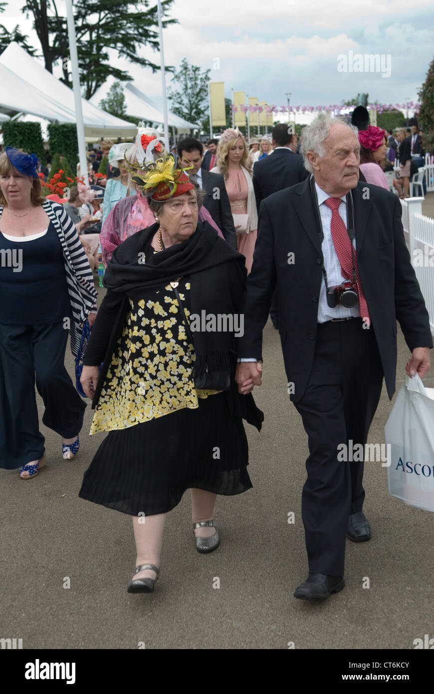 England senior couple holding hands new best clothes for Ladies Day at Royal Ascot horse racing Berkshire. 2012, 2010s UK  HOMER SYKES Stock Photo