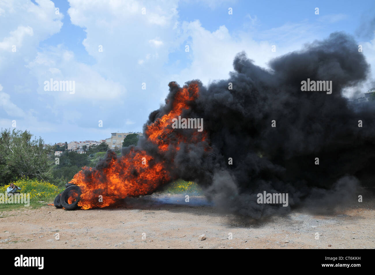 Burning tyres. Tyres are burnt as part of a demonstration to block