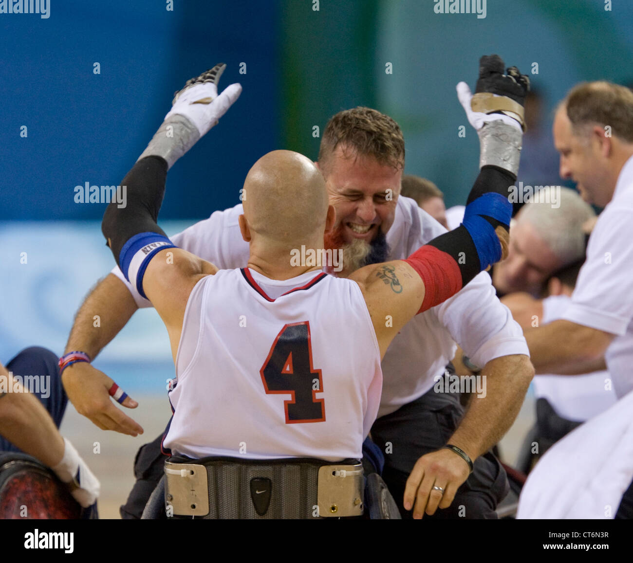 United States' coach Bob Murray hugs player Bryan Kirkland (4) after winning the gold medal in Paralympic men's wheelchair rugby Stock Photo