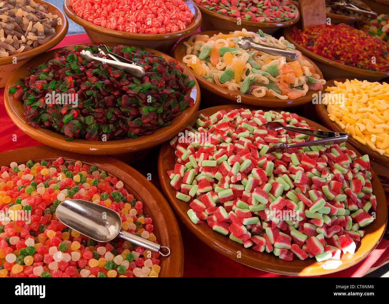 Bowls of assorted candies on market stall Stock Photo Alamy