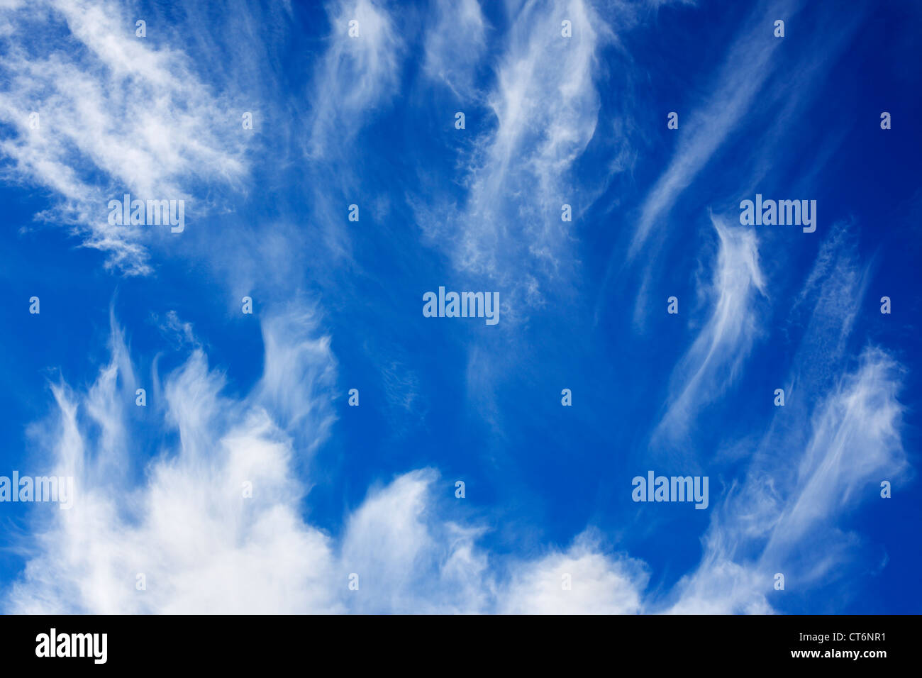 Some wispy white clouds moving across the sky. Stock Photo