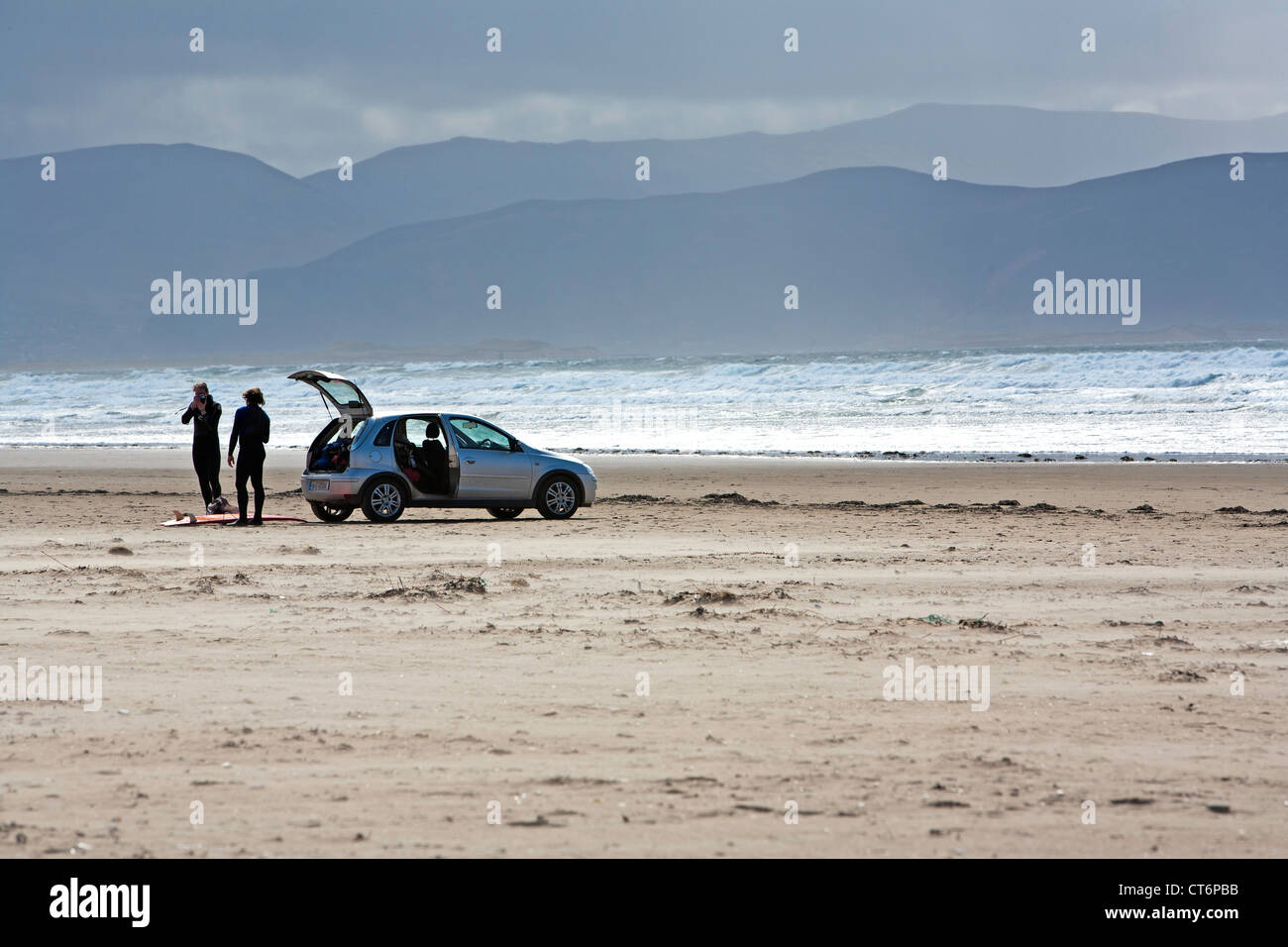 Two surfers on Inch Strand with their car, Dingle Peninsula, Ireland Stock Photo Alamy