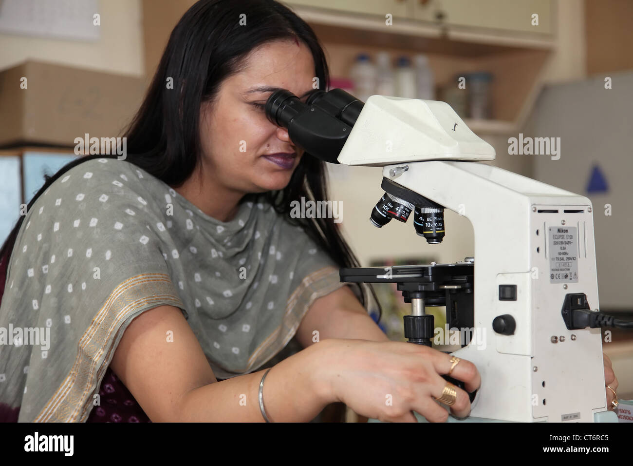 Indian Student With Microscope In A Laboratory Stock Photo Alamy