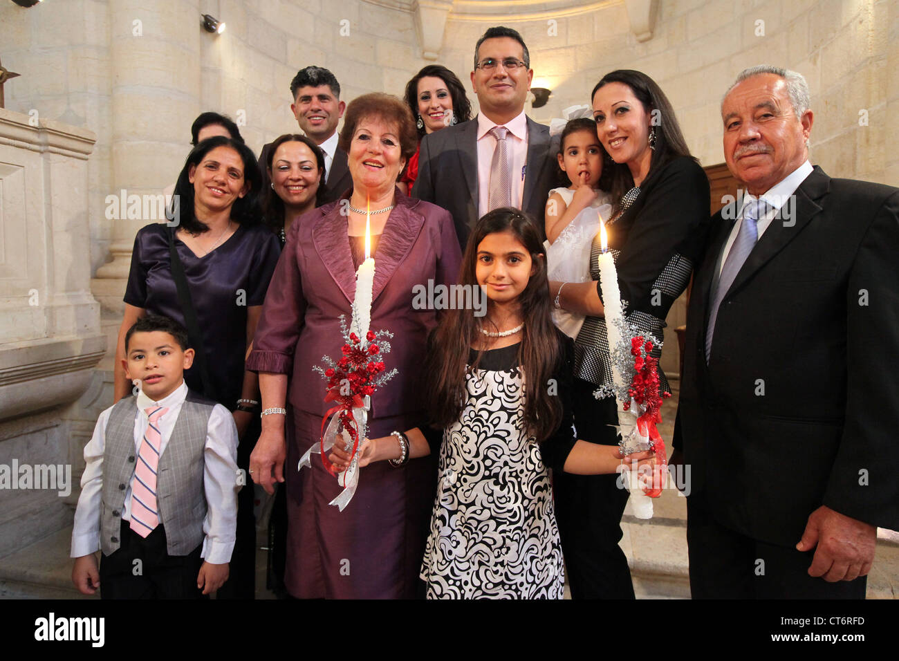 Christian lutheran family with newly baptised girl at the Lutheran Christmas Church in Bethlehem, Palestine, West Bank Stock Photo