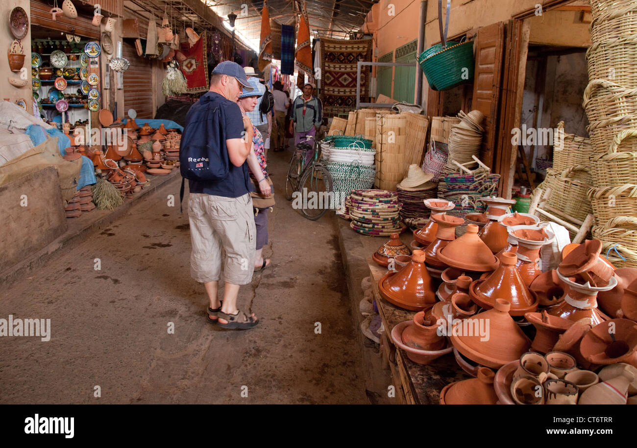 Tourists buying a tagine in the market (souk), Taroudant, Morocco