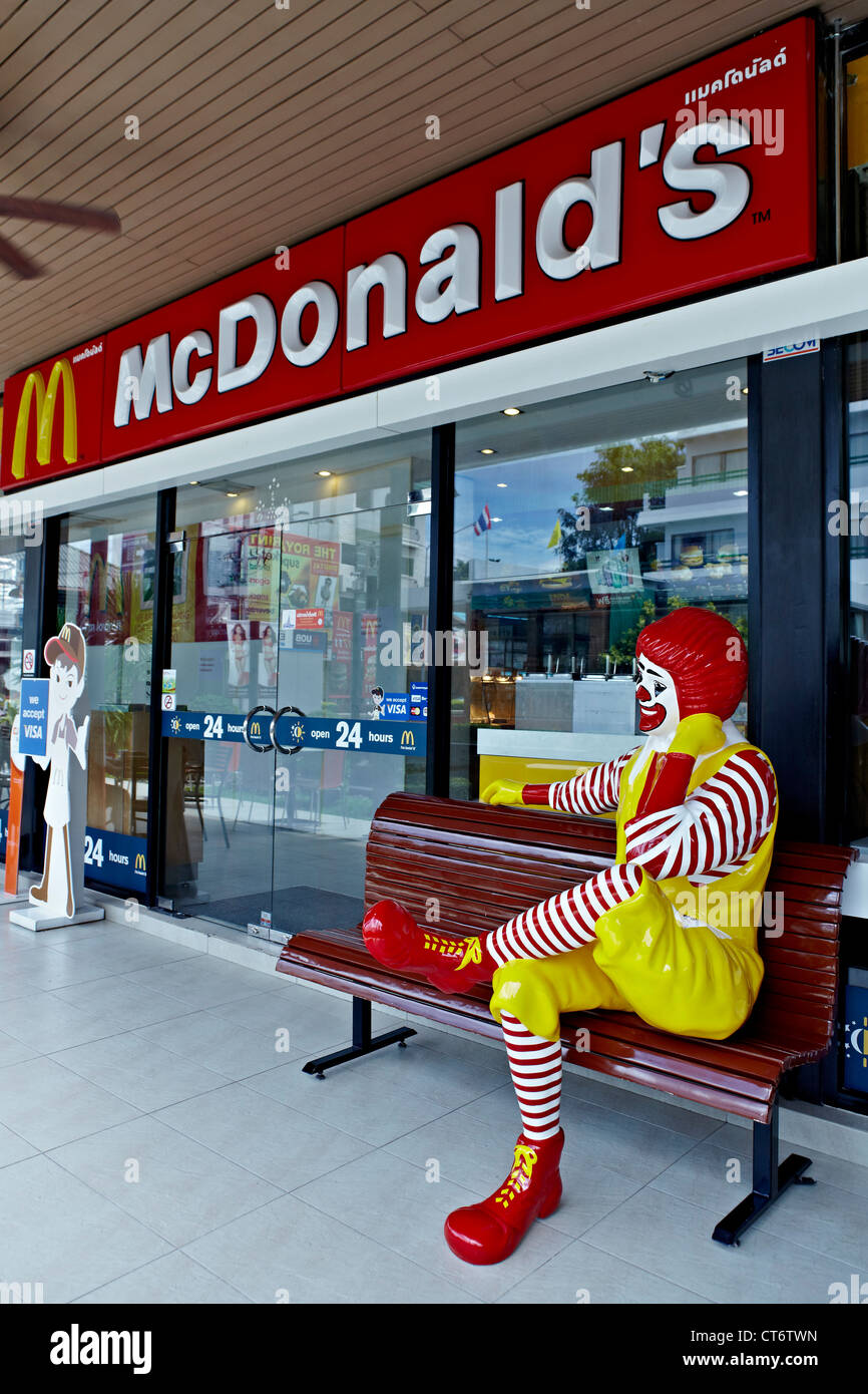 McDonald's restaurant featuring a seated Ronald McDonald figure. Thailand S. E. Asia. Stock Photo