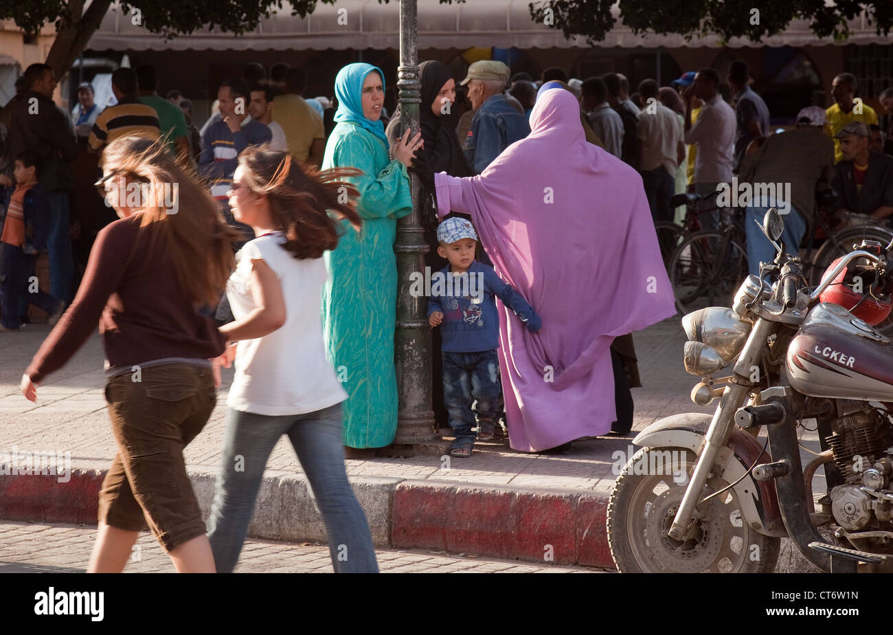 Contrast of modern and traditional islamic women in the streets of Taroudant, Morocco Africa Stock Photo