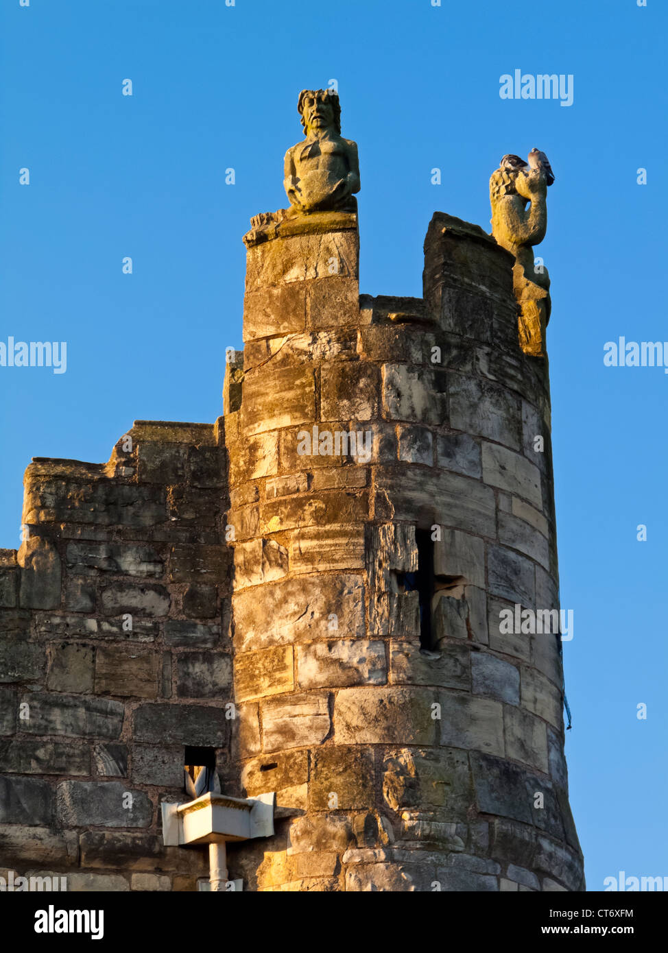 Detail of Monk Bar tower with small statues and arrow slit in the walls in the City of York in North Yorkshire England UK Stock Photo