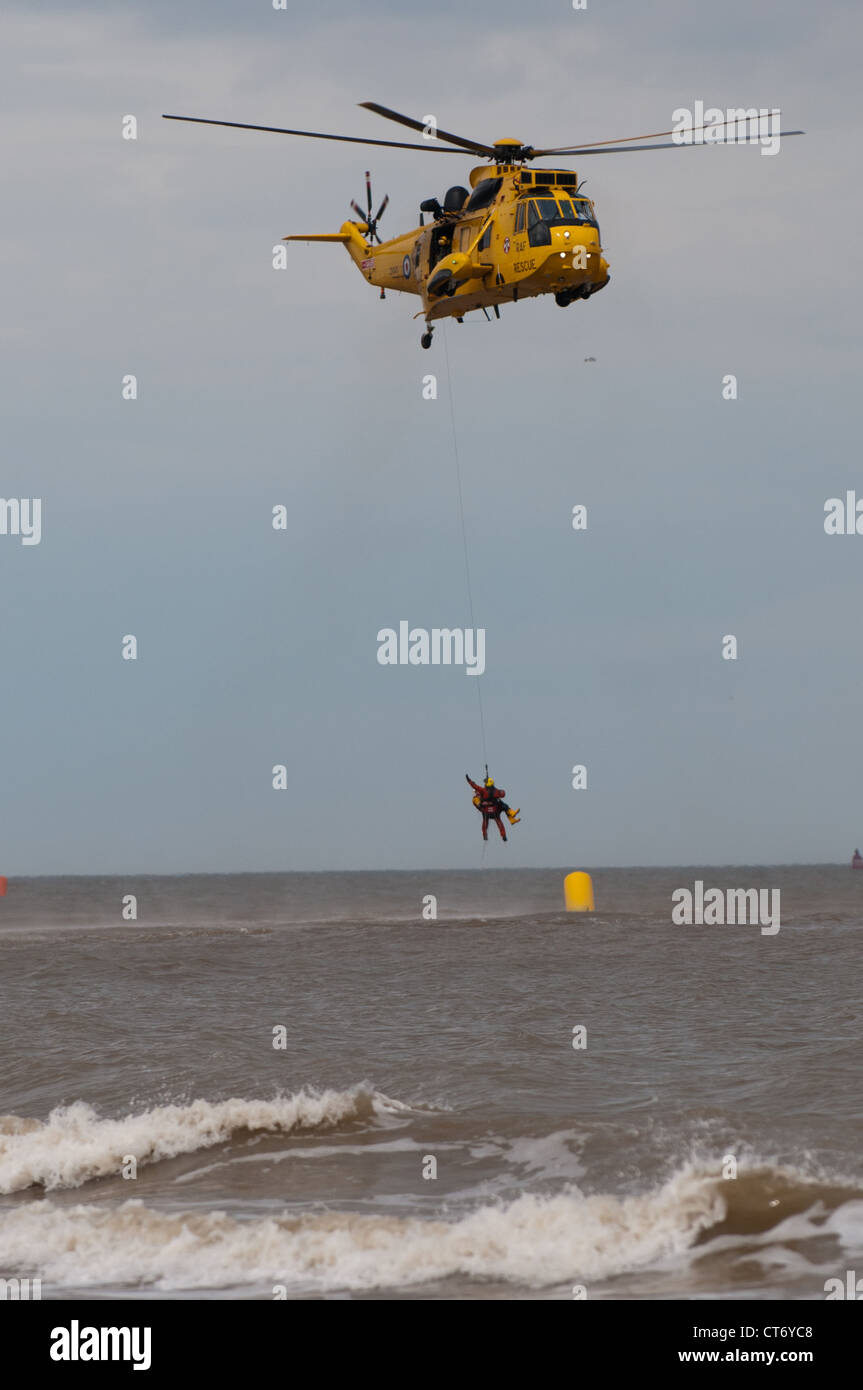 RAF SAR Sea King performing an off-shore rescue exercise at Lowestoft Airshow 2012 Stock Photo