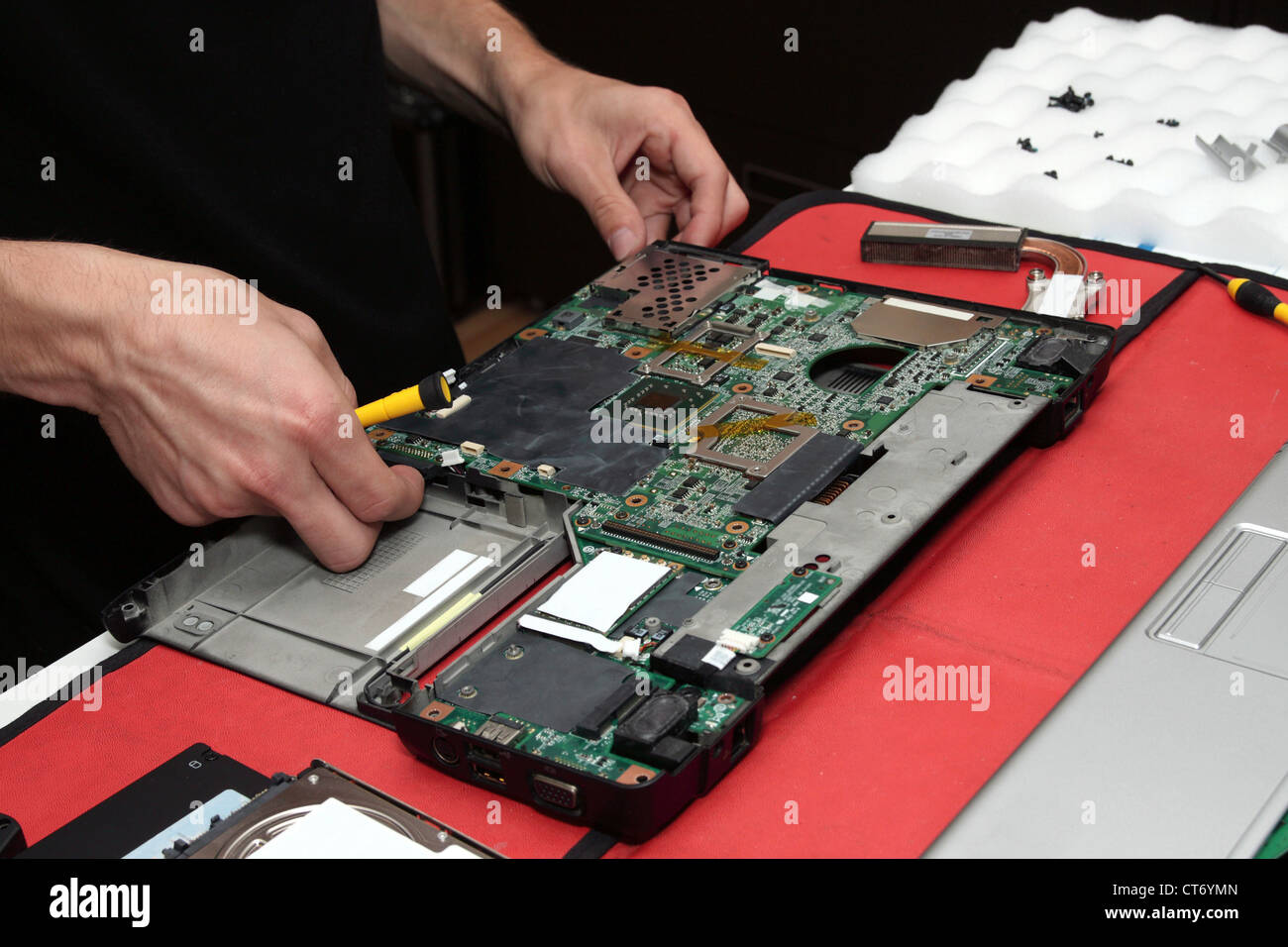 Closeup of computer being repaired by technician. Stock Photo