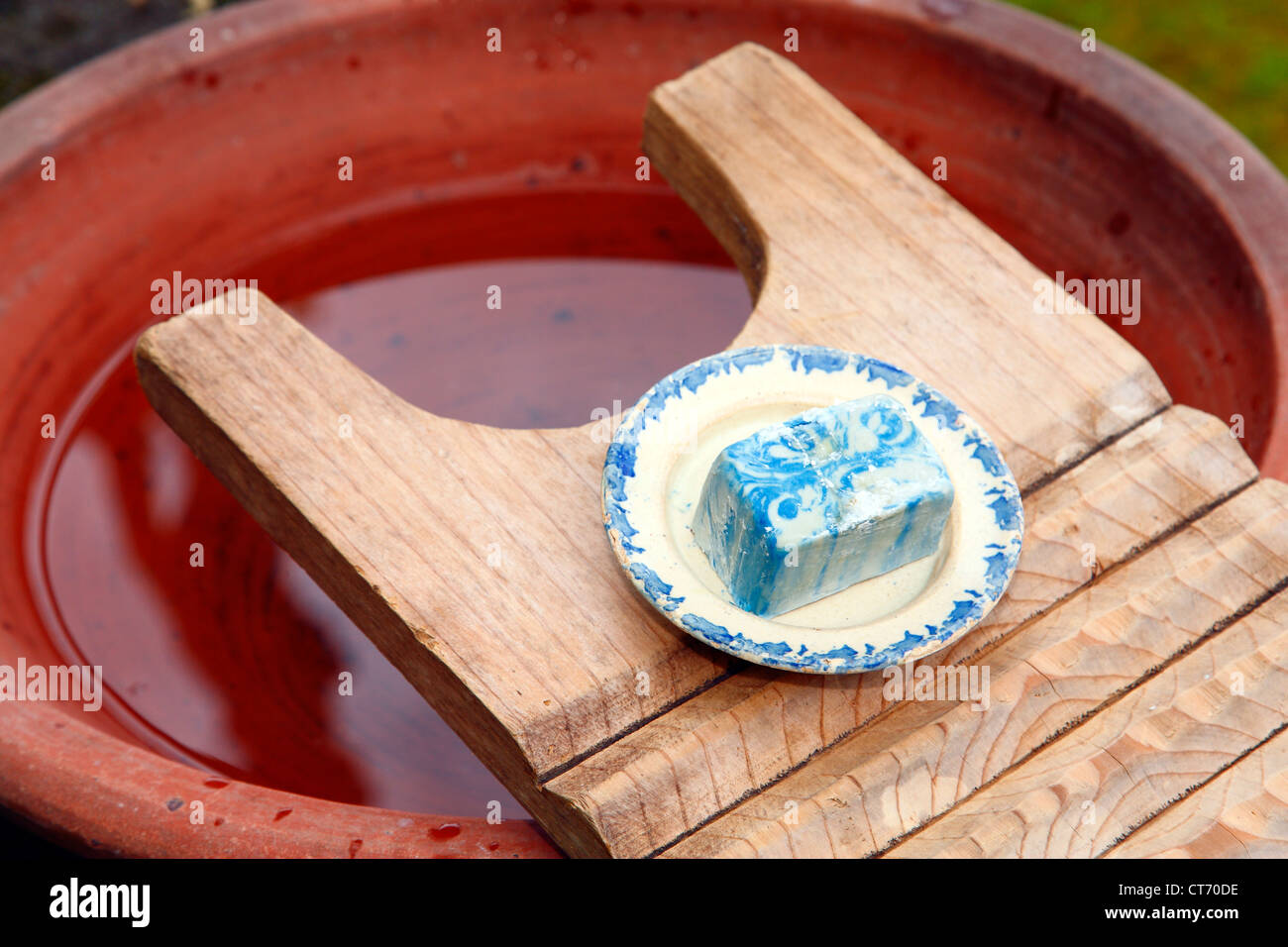 Soap and wooden washboard Stock Photo