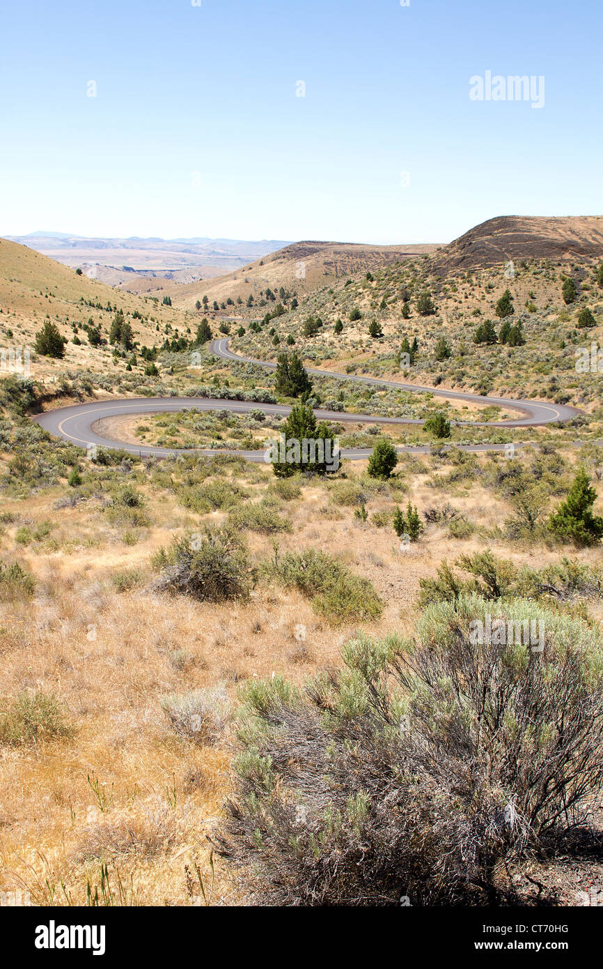 Long Winding Highway Along High Desert in Central Oregon Stock Photo