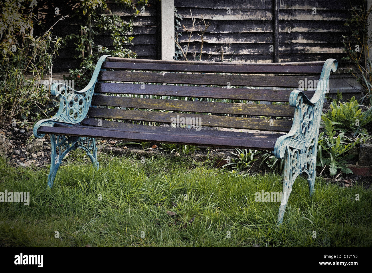 Vintage bench in a garden retro style picture with film grain and vignette Stock Photo Alamy