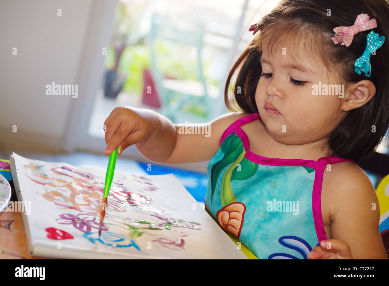 Two year old playing with paints Stock Photo Alamy
