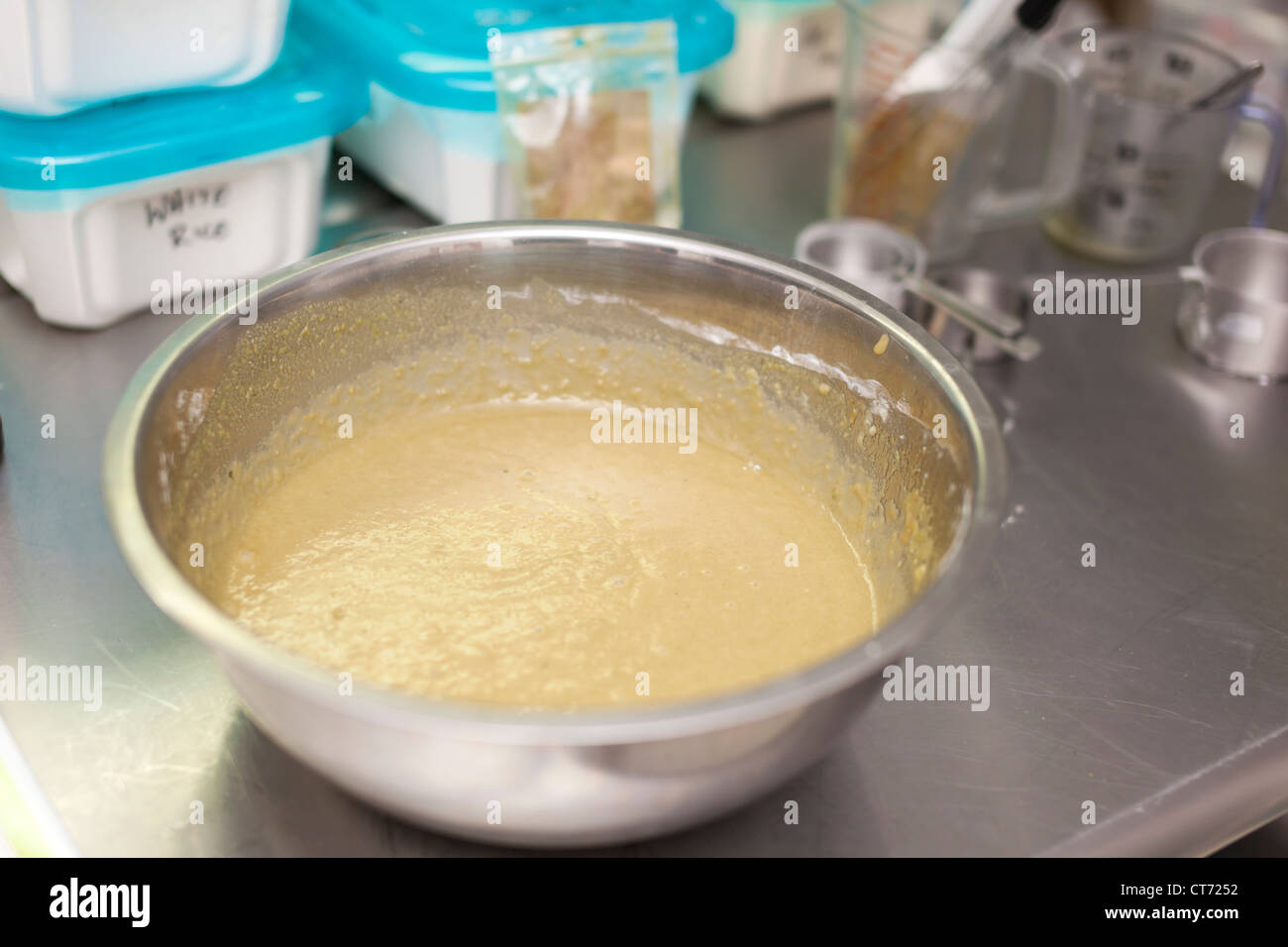 A large mixing bowl and ingredients at Tandmen Doughnuts, a small boutique bakery in Missoula, Montana. Stock Photo