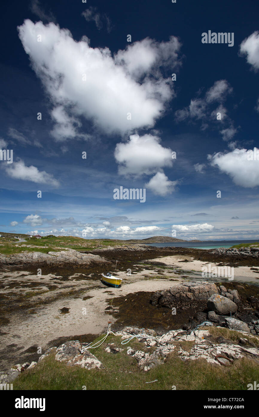 Isle of Barra, Scotland. Picturesque view of a small yellow fishing boat on the east coast of Barra at Earsairidh. Stock Photo