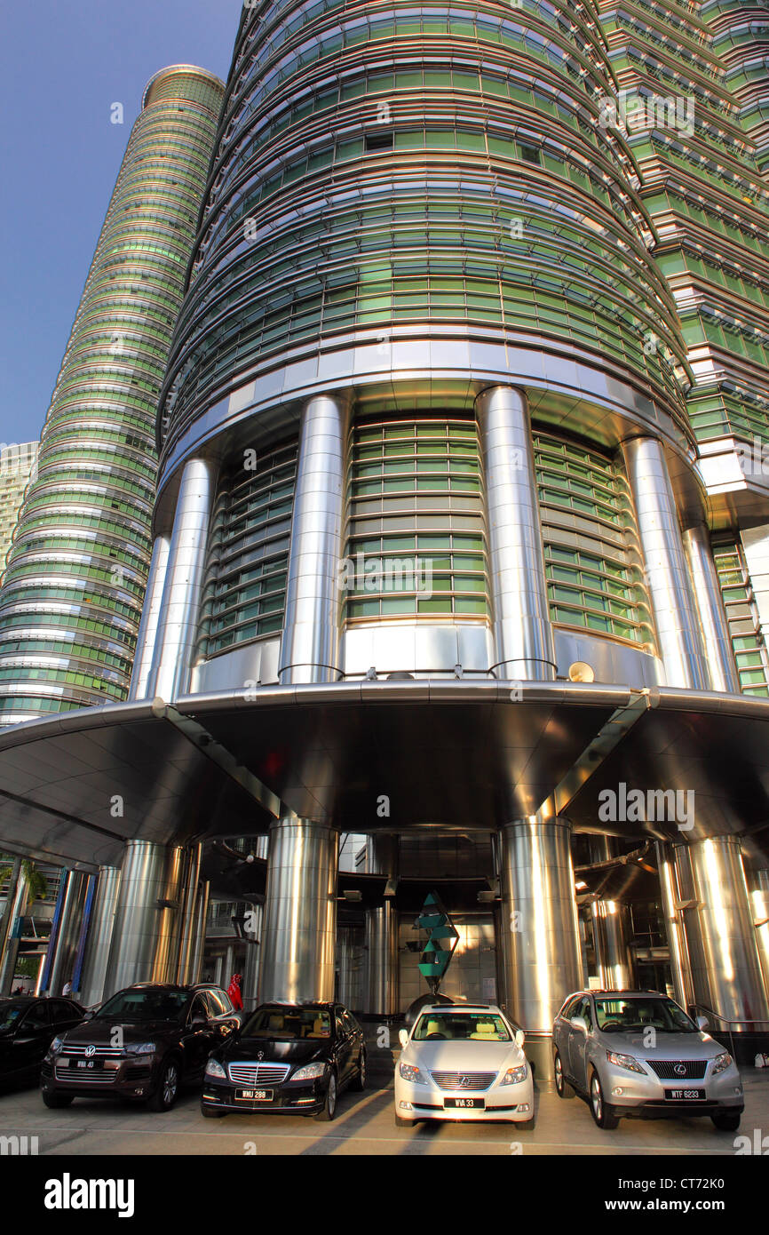 Petronas Towers and luxury automobiles in Kuala Lumpur. Stock Photo