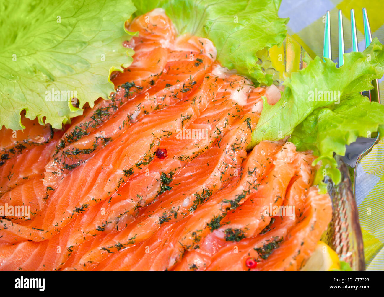 Close-up photo of smoked salmon slices served with salad and dill Stock Photo