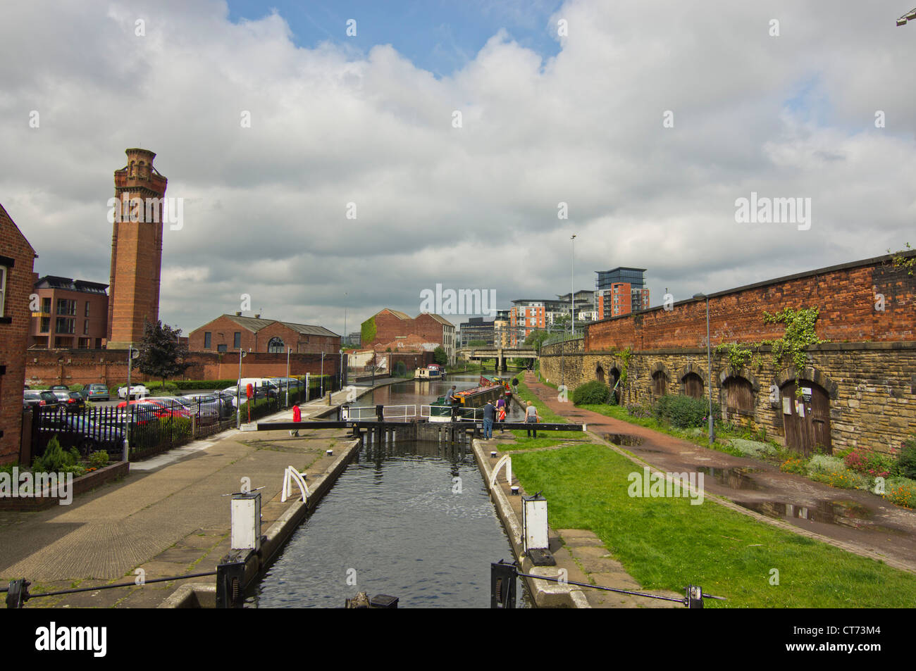 Canal boats going through one of the Locks on the Leeds & Liverpool canal in the center of Leeds Stock Photo