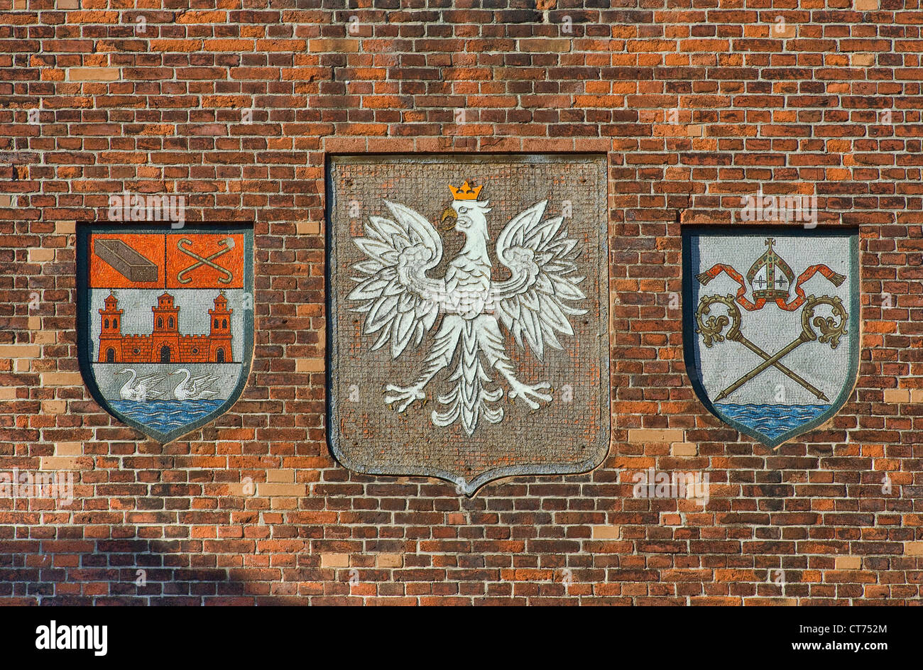 Coats of arms of Poland and city at town hall in Kołobrzeg in Pomerania, West Pomeranian Voivodeship, Poland Stock Photo