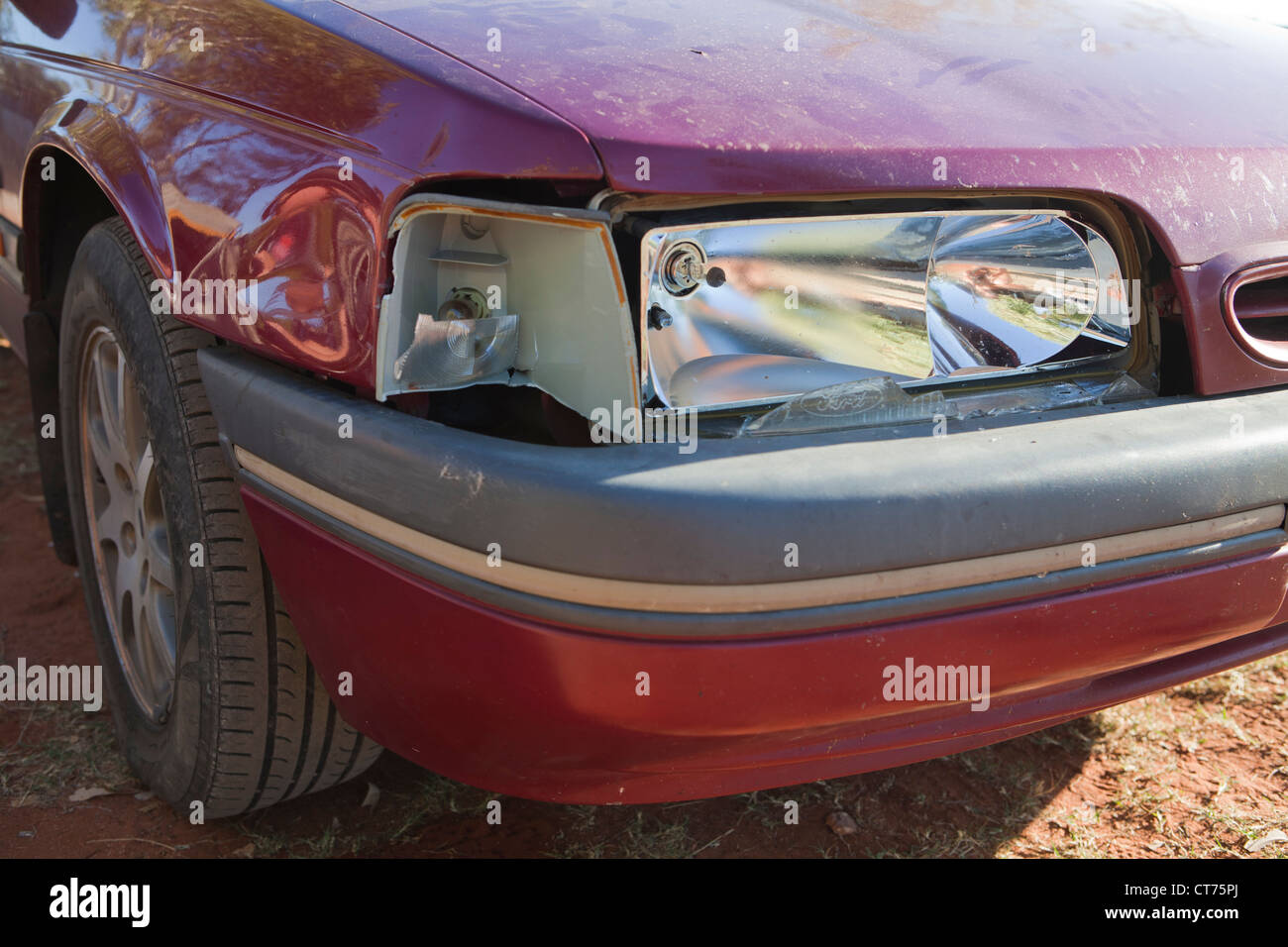 Broken Car after a Crash. Damaged Wing and Headlamp of a Car