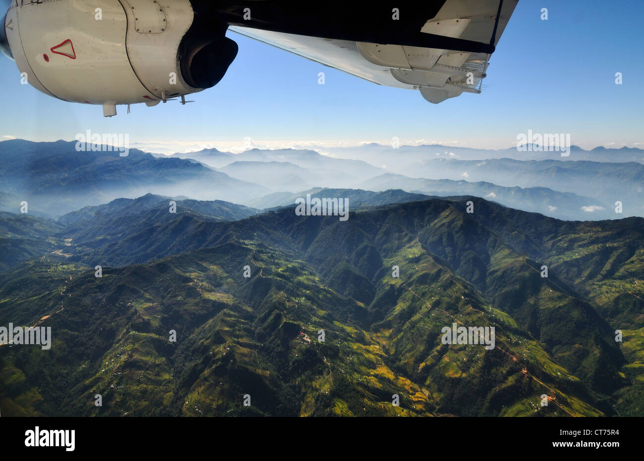 view from airplane at mountain range in Nepal Stock Photo