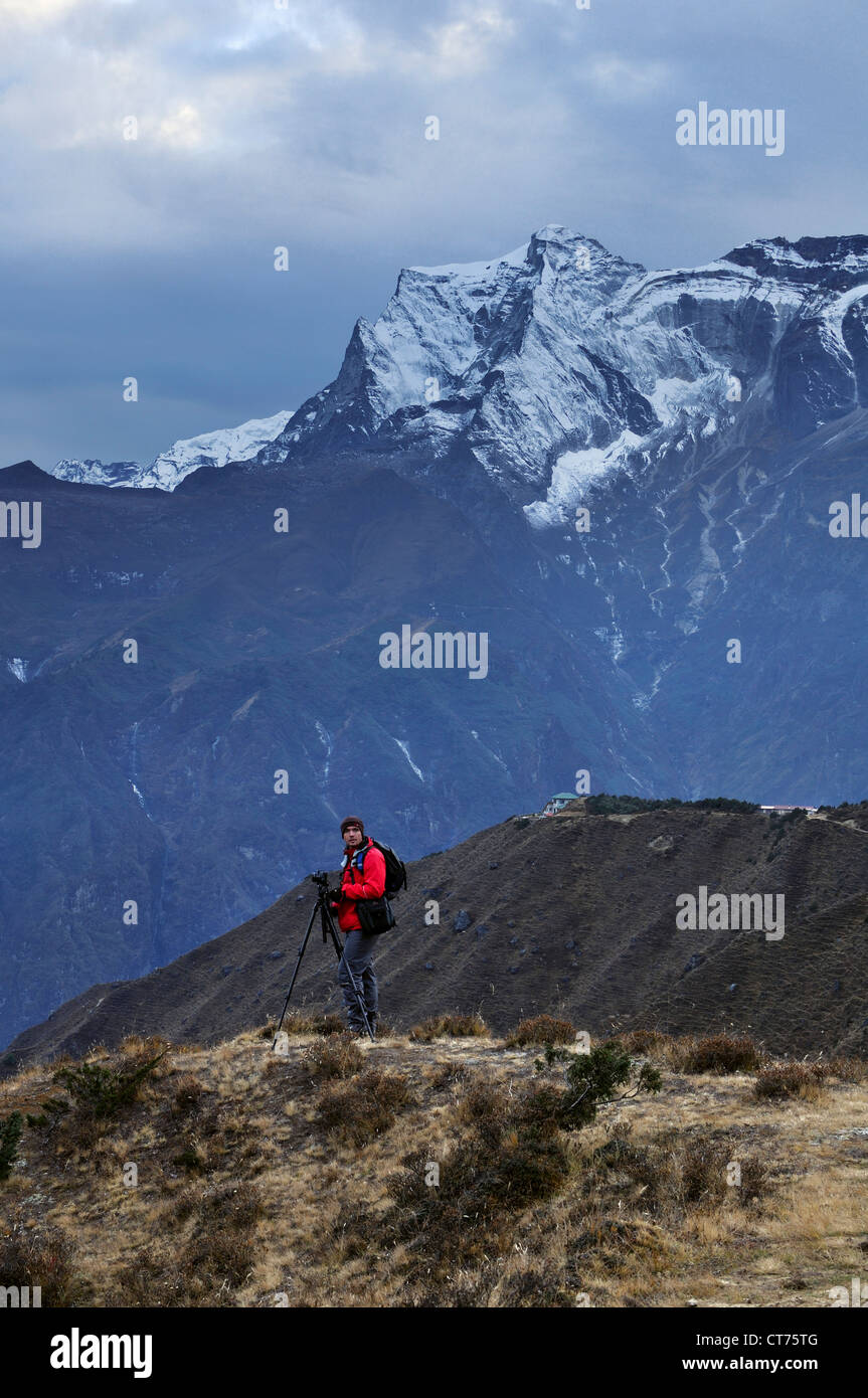 photographer in Nepal looking at Kongde Ri mountain Stock Photo