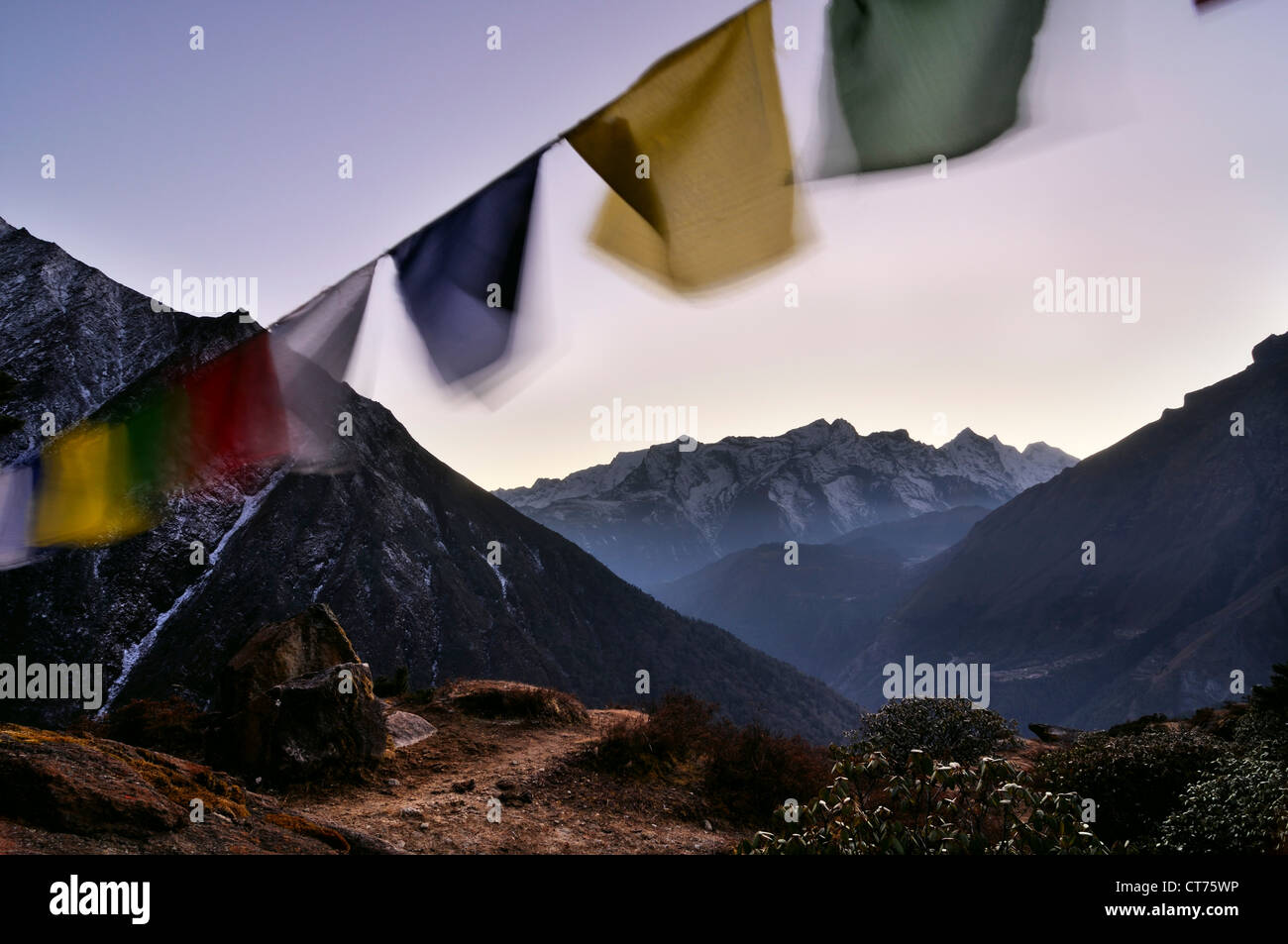 Nepal landscape with prayer flags and Kongde Ri mountain in background Stock Photo