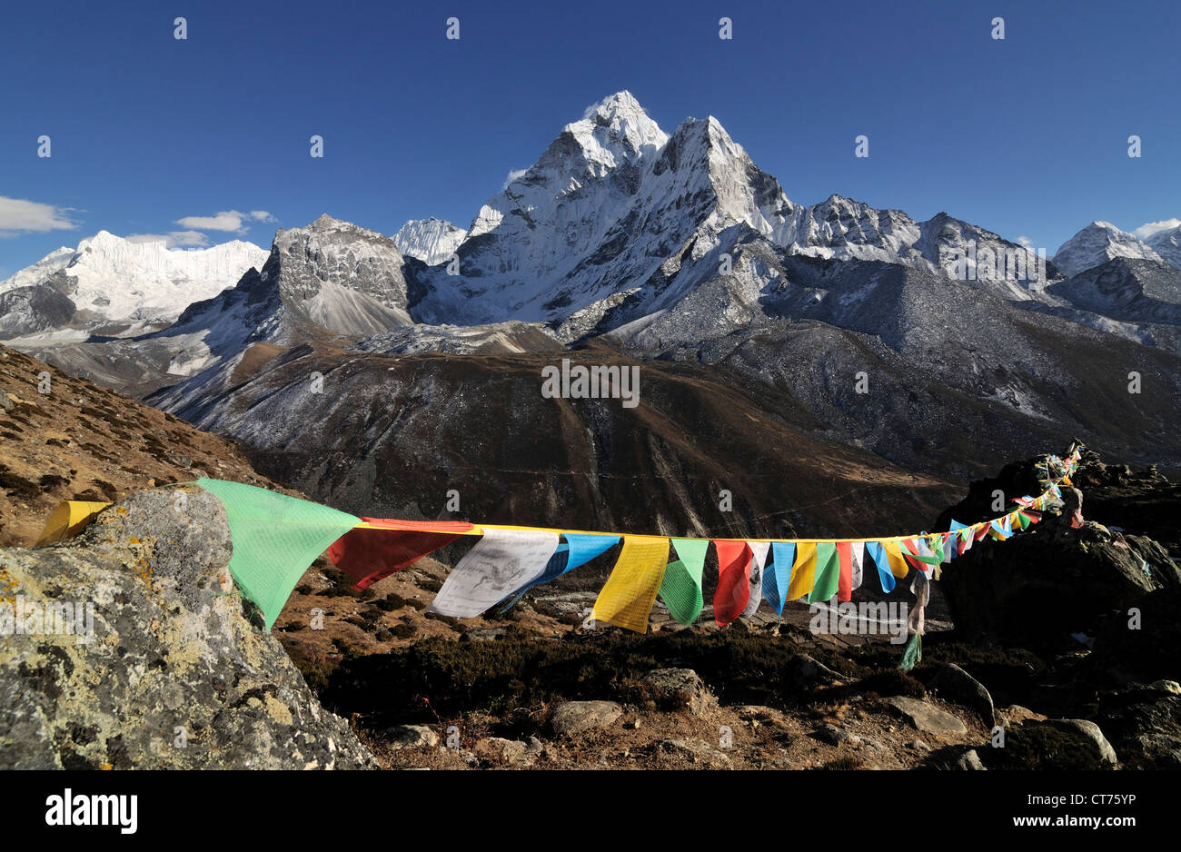 buddhist prayer flags in front of Nepal mountains Stock Photo