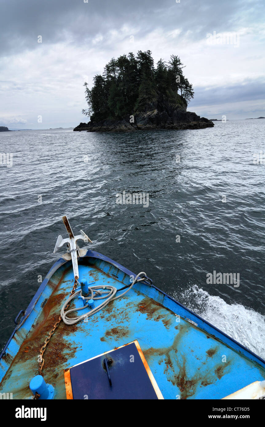 boat near small island at pacific rim national park Stock Photo