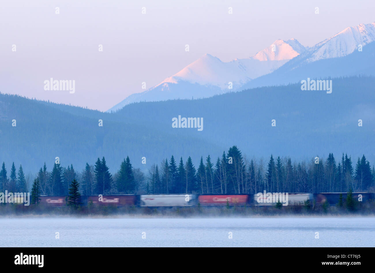 freight train in front of sundance range at banff national park Stock Photo