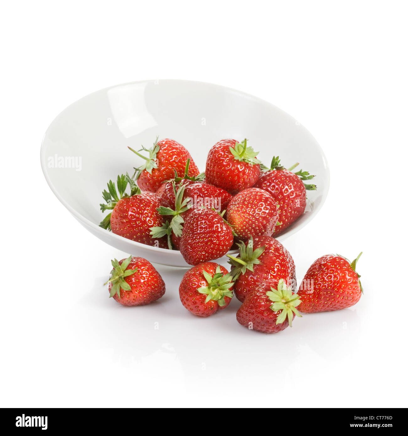 White plate of fresh strawberries on white background Stock Photo - Alamy