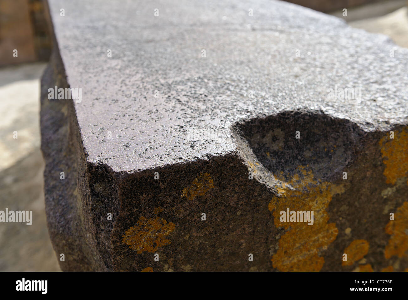 Large block of stone worn smooth probably during transport from
