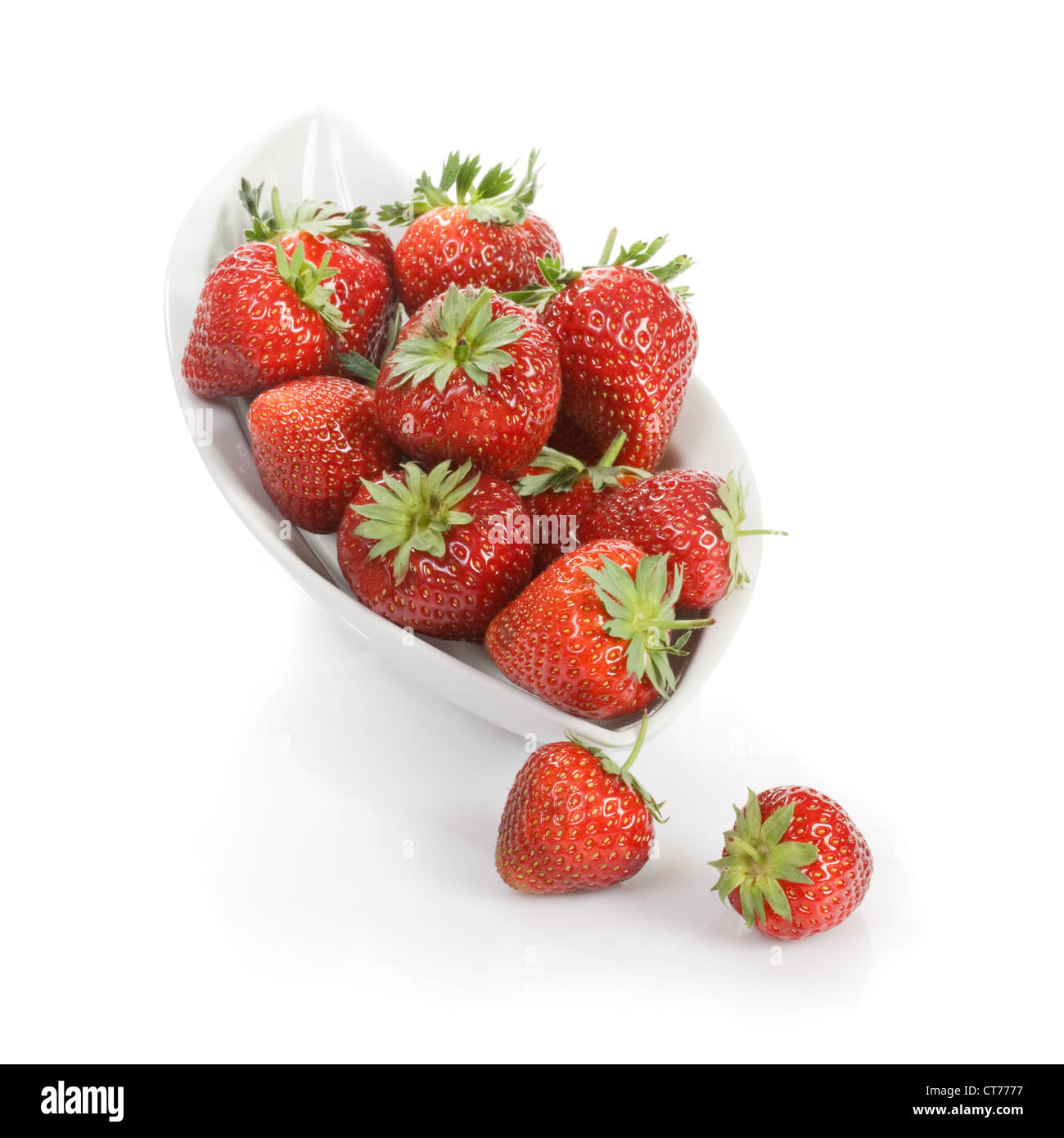 White plate of fresh strawberries on white background Stock Photo - Alamy