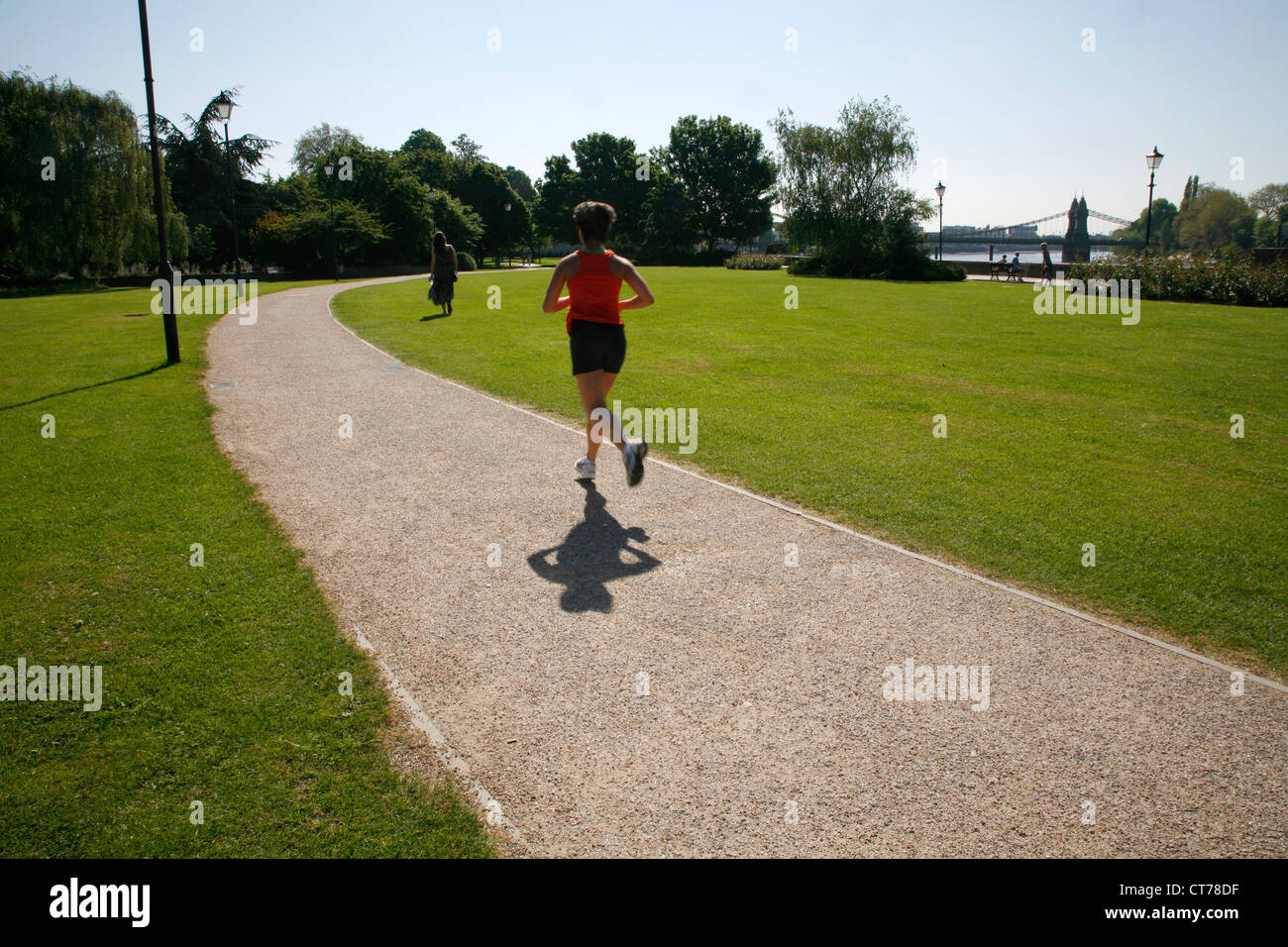Jogger running through Furnivall Gardens, Hammersmith, London, UK Stock Photo